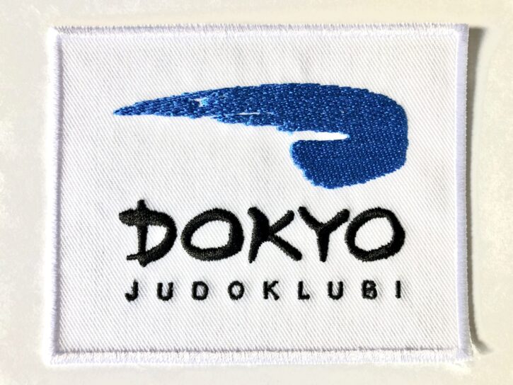 dokyo embleem